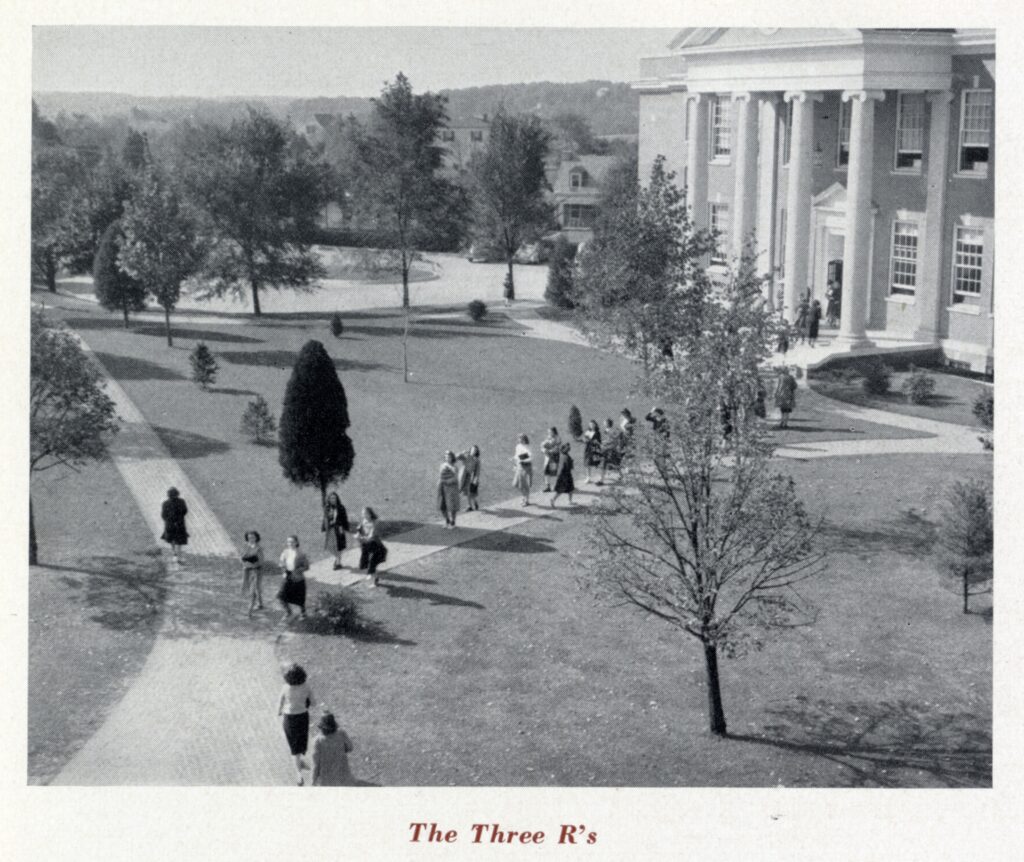 A black and white photo of students walking to and from Chandler Hall on the paths. This photo was taken from a higher floor in Virginia Hall. There is text at the bottom of the picture that says "The Three R's."