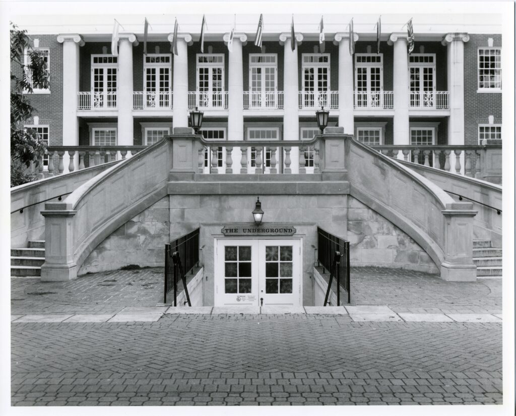 A black and white picture showing the steps in front of Lee Hall and the entrance to the Underground located right in the middle of the two curved staircases on either side of it.